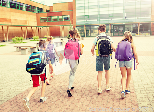 Image of group of happy elementary school students running