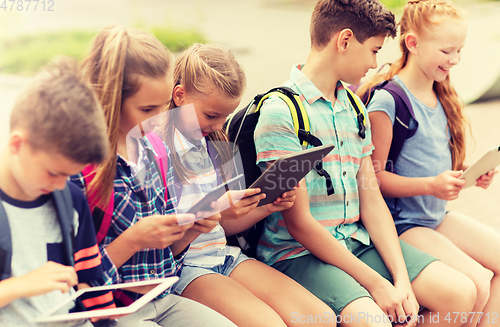 Image of group of happy elementary school students talking