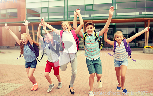 Image of group of happy elementary school students running