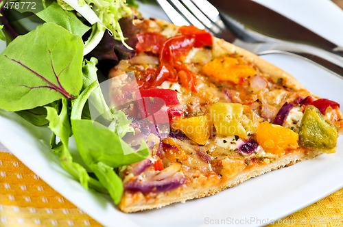 Image of Vegetarian pizza with salad