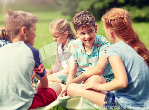 Image of group of happy kids or friends outdoors