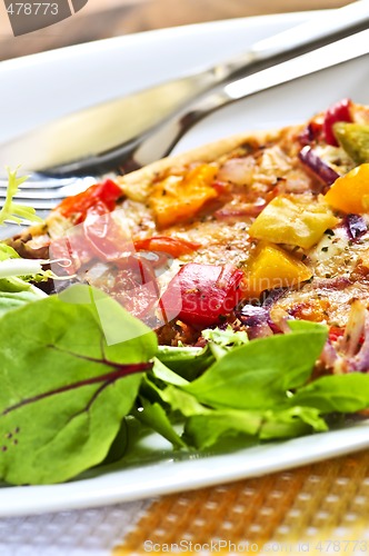 Image of Vegetarian pizza with salad