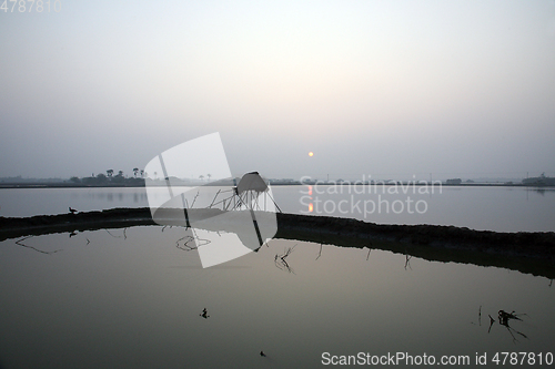 Image of A stunning sunrise looking over the holiest of rivers in India. Ganges delta in Sundarbans, West Bengal, India.