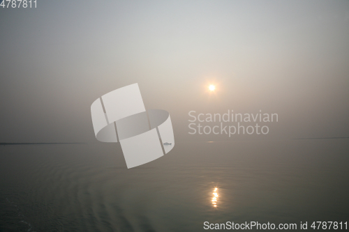 Image of A stunning sunrise looking over the holiest of rivers in India. Ganges delta in Sundarbans, West Bengal, India.