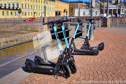 Image of Tier E-Scooters Parked in City