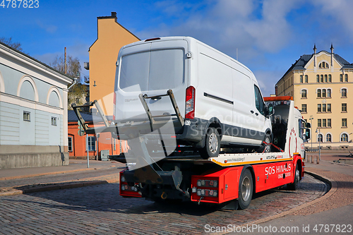 Image of Tow Truck Carries Breakdown Van