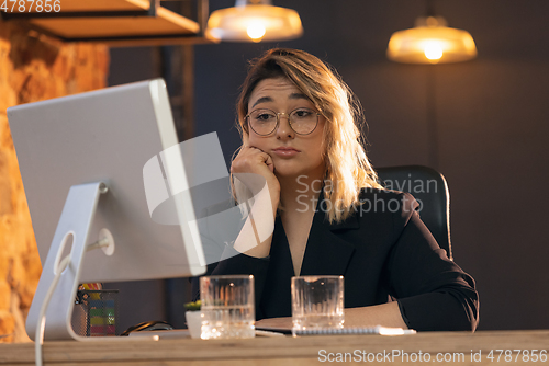 Image of Businesswoman, manager working in modern office using devices and gadgets