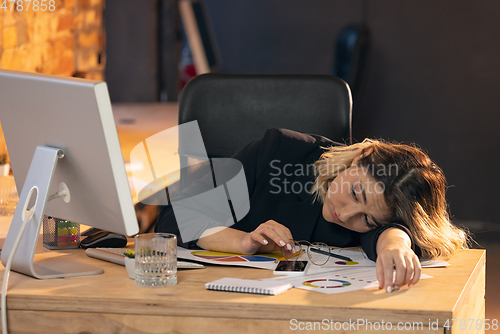 Image of Businesswoman, manager working in modern office using devices and gadgets