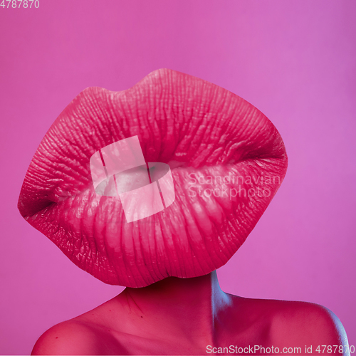 Image of Modern design, contemporary art collage. Inspiration, idea, trendy urban magazine style. Female body headed with big kissing lips on purple background