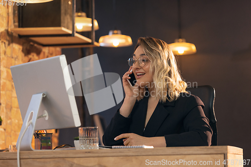 Image of Businesswoman, manager working in modern office using devices and gadgets
