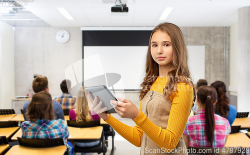 Image of student girl using tablet computer at school