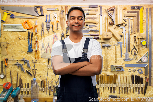 Image of happy indian worker or builder with crossed arms