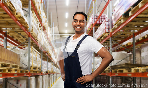 Image of happy smiling indian worker or loader at warehouse