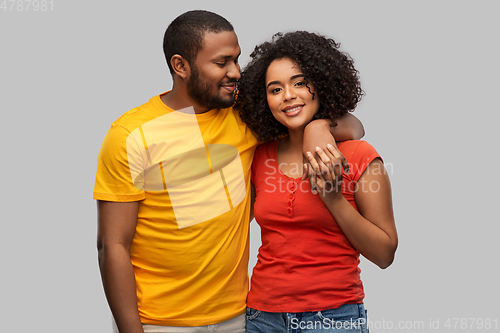Image of happy african american couple hugging