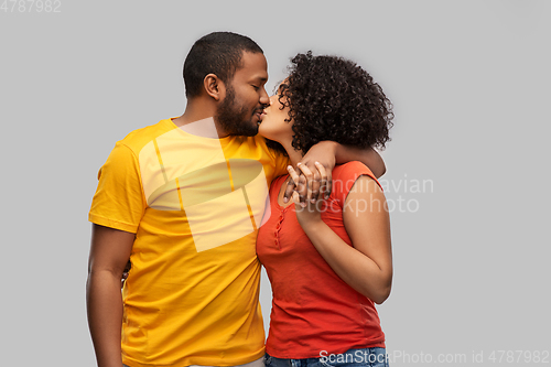 Image of happy african american couple kissing