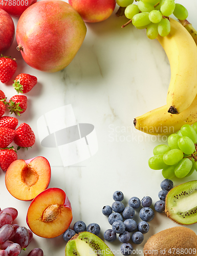 Image of frame of fresh fruit and berries