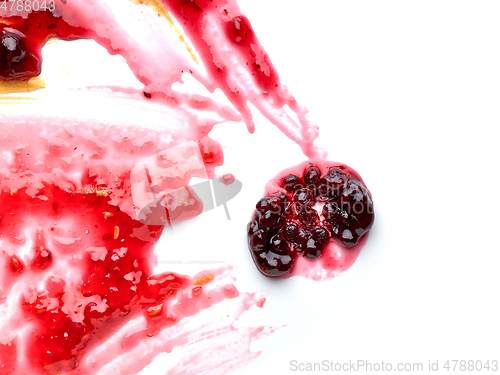 Image of red berry jam on white background