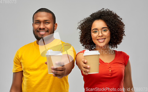 Image of happy african american couple with coffee cups