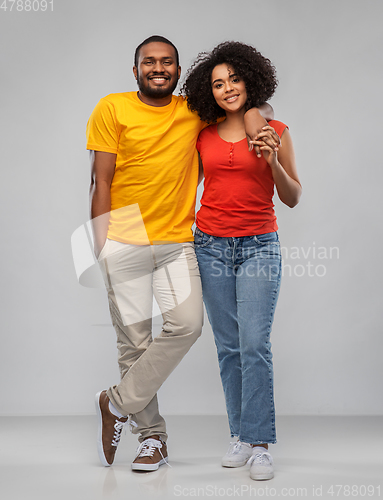 Image of happy african american couple hugging