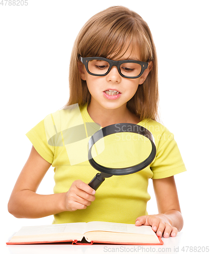 Image of Little girl is reading book