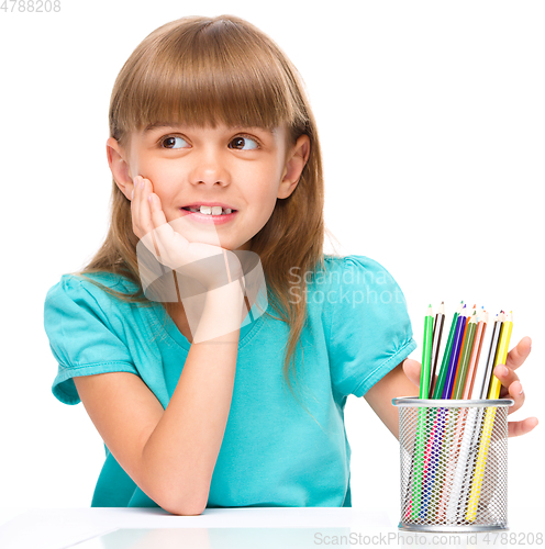 Image of Little girl with color pencils