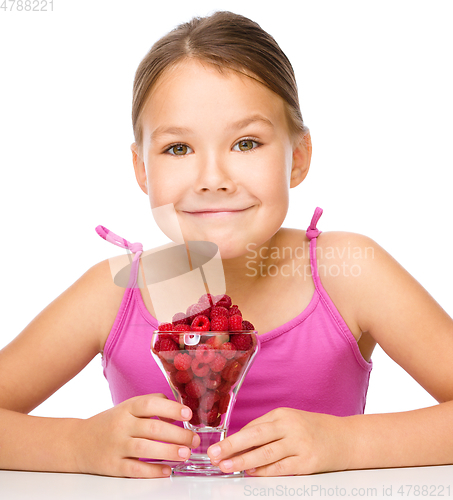 Image of Little girl with raspberries