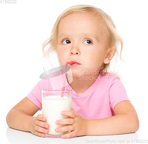 Image of Cute little girl with a glass of milk