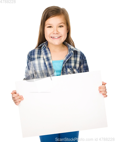 Image of Little girl is holding a blank banner