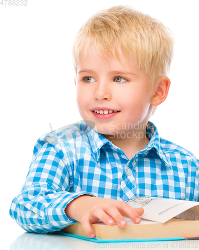 Image of Little child play with book