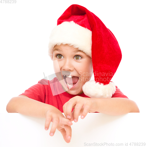 Image of Little girl is holding blank board