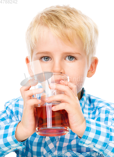 Image of Little boy with glass of cherry juice