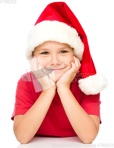 Image of Portrait of a cute little girl in santa hat