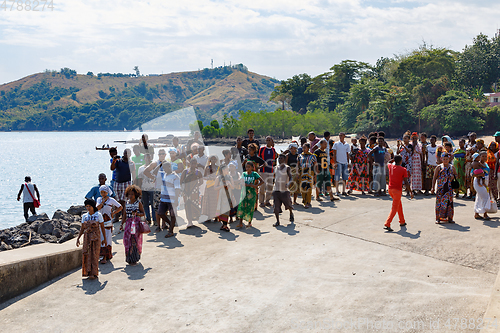 Image of Malagasy woman waiting for transport ship, Nosy Be, Madagascar