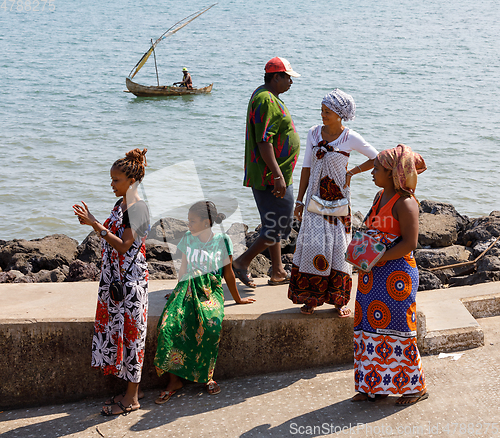 Image of Malagasy woman waiting for transport ship, Nosy Be, Madagascar
