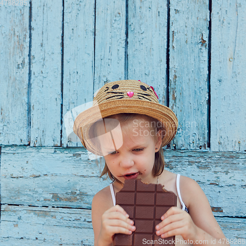 Image of Girls eat chocolate
