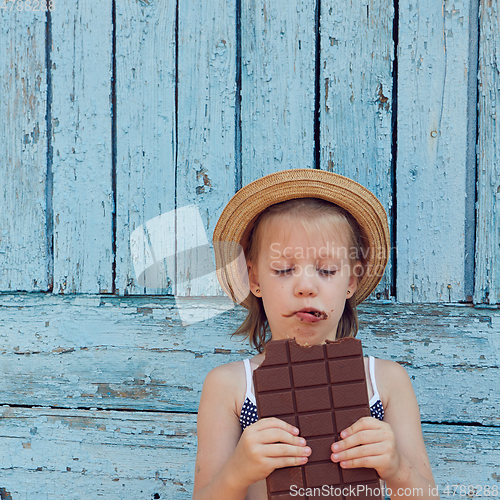 Image of Girls eat chocolate