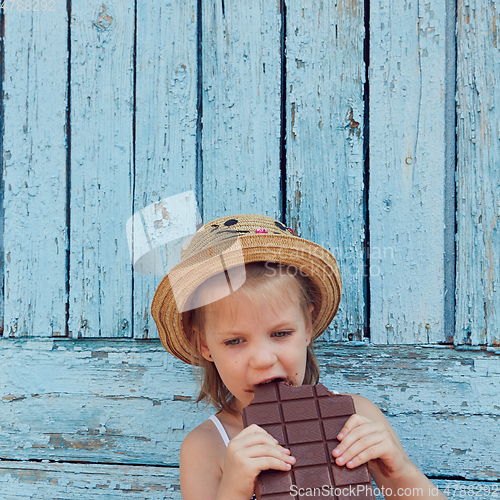 Image of Girls eat chocolate