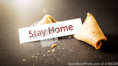 Image of a fortune cookie with message stay home