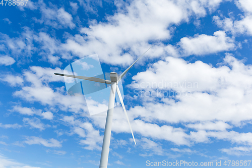 Image of Wind turbine with blue sky