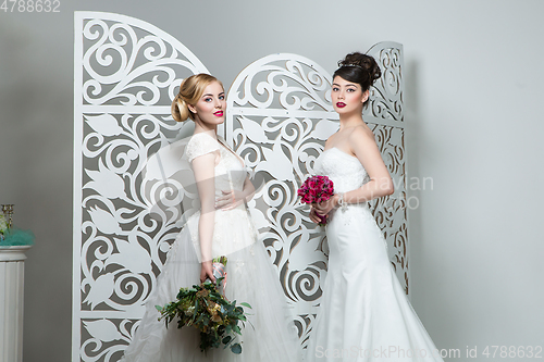 Image of beautiful girls in wedding gown