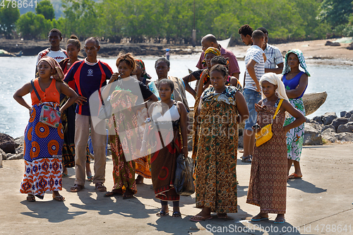 Image of Malagasy woman waiting for transport ship, Nosy Be, Madagascar