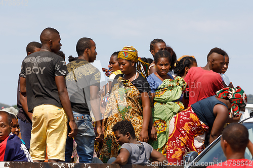 Image of Malagasy woman waiting for transport ship, Nosy Be, Madagascar