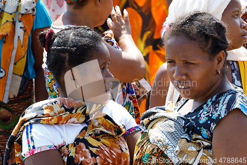 Image of Malagasy woman waiting for transport ship, Nosy Be, Madagascar