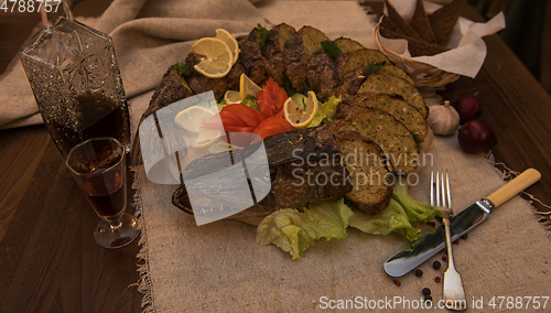 Image of Stuffed pike with vegetables and greens.