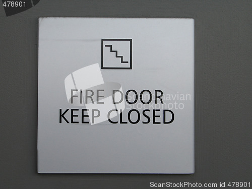 Image of a grey fire door keep closed sign