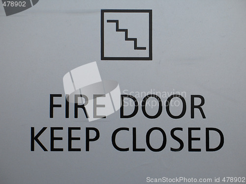 Image of a grey fire door keep closed sign