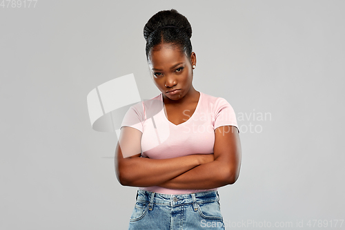 Image of sad african american woman with crossed arms