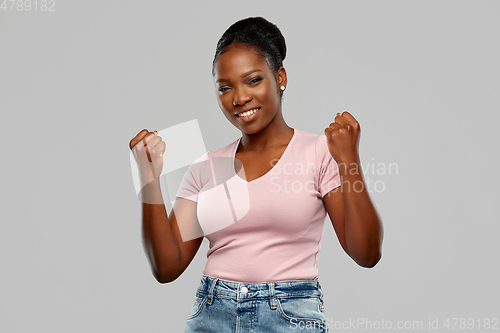 Image of happy african american woman celebrating success