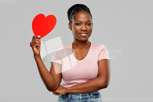 Image of happy african american woman with red heart