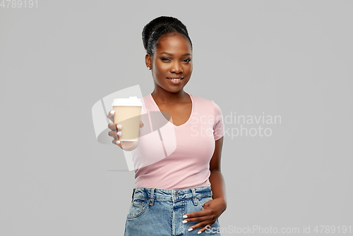 Image of happy african american woman drinking coffee